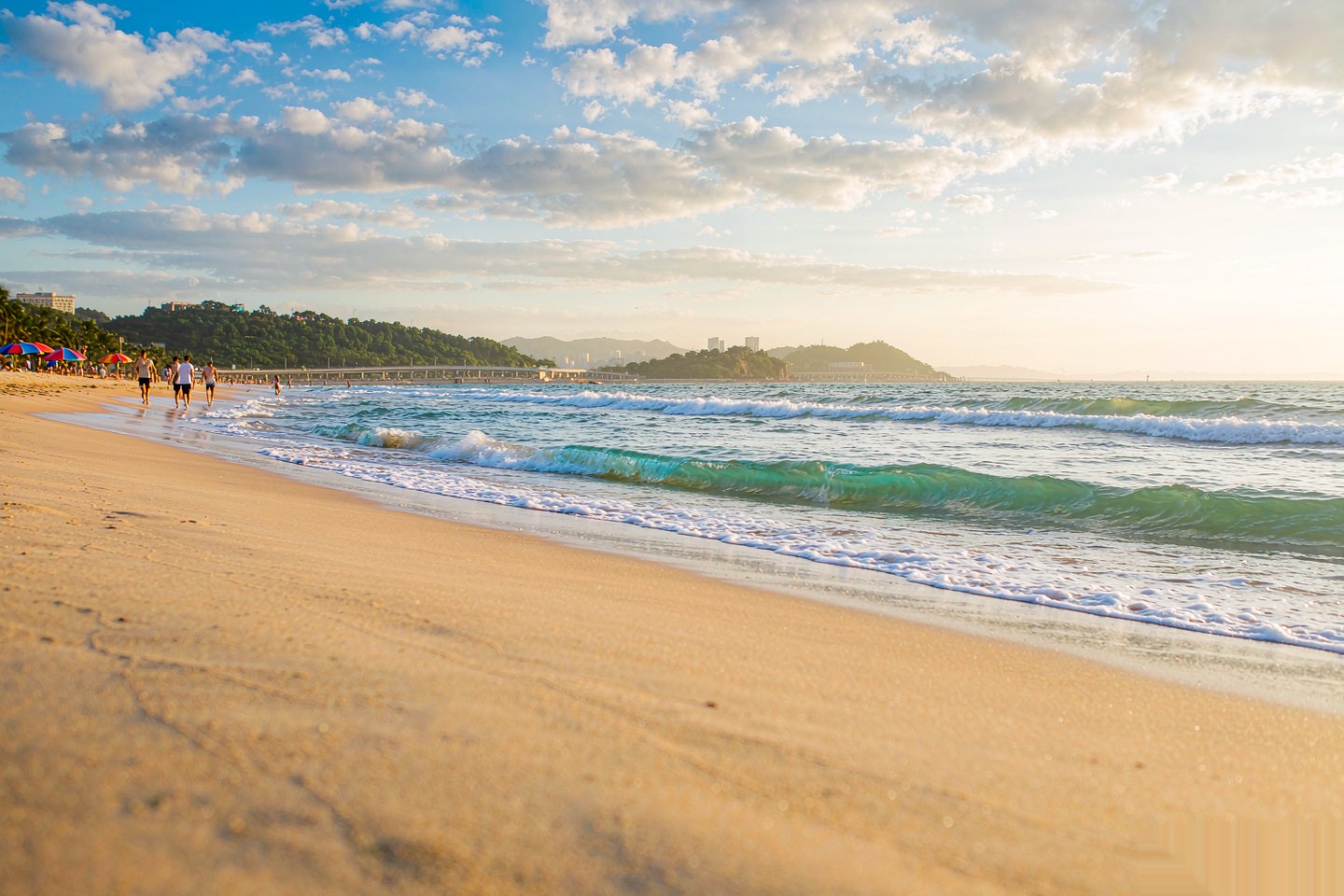 Golden sand and gentle surf at Golden Beach across the bay in Huangdao
