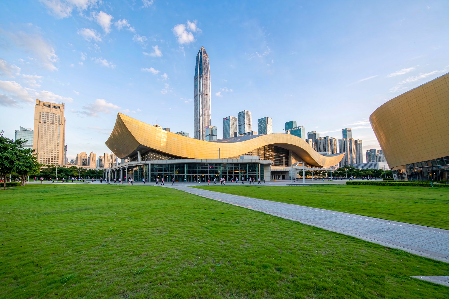 The Shenzhen Civic Center with its wavy golden roof and the Ping An Finance Centre seen from Lianhuashan Park