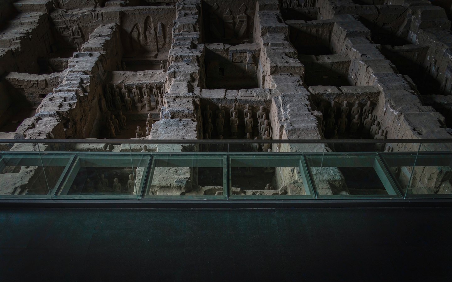 Glass walkway suspended over Han burial pits of small figurines