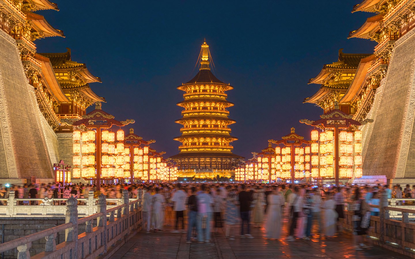 Tang-style boulevard blazing with lights below a giant pagoda