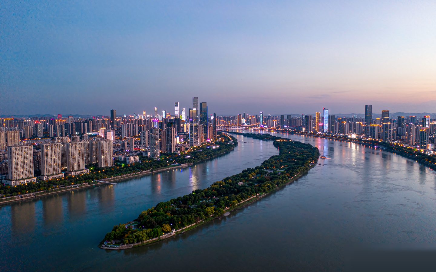 The Changsha skyline and Orange Isle on the Xiang River at dusk