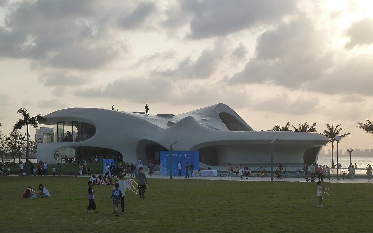 The white cave-like Cloud Cave Library on Haikou's west coast under a cloudy sky