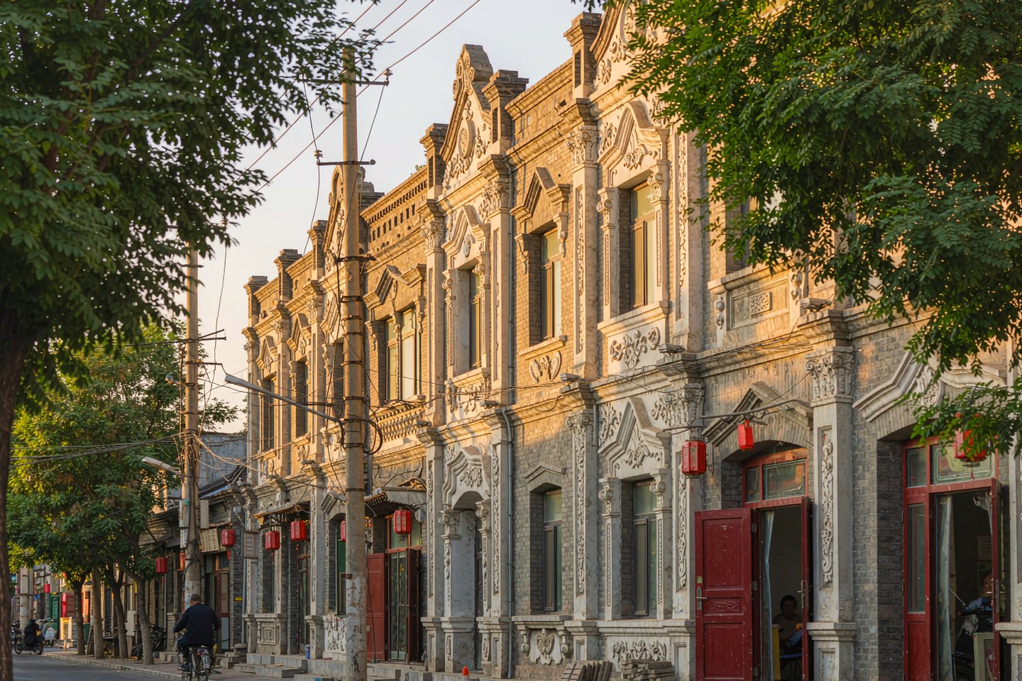 Carved baroque facades on a lane in Harbin's Laodaowai quarter in late afternoon light