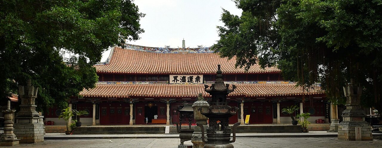 The main hall of Kaiyuan Temple behind a bronze incense burner