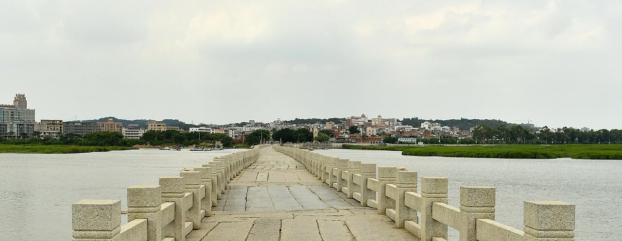 The long stone beams of Luoyang Bridge stretching across the estuary