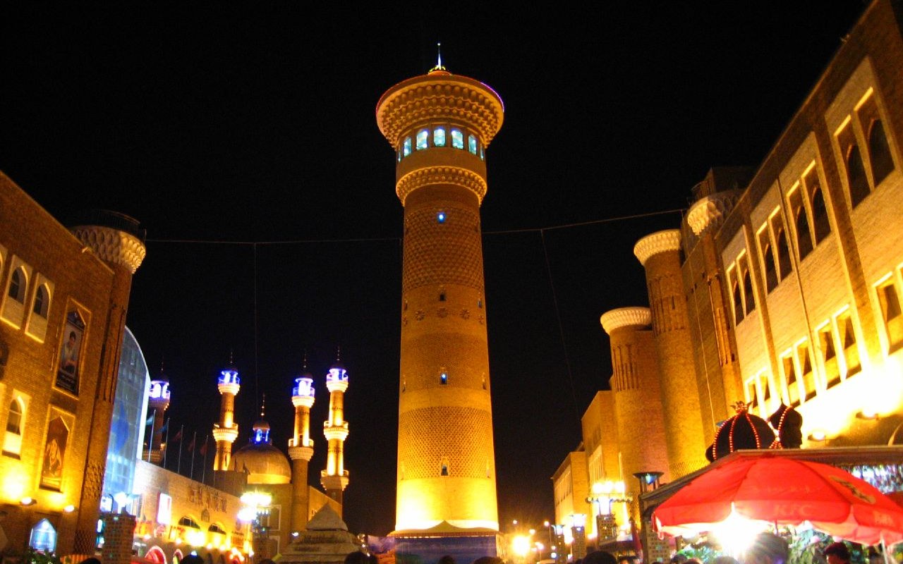 The Grand Bazaar's viewing tower lit gold over the night crowds
