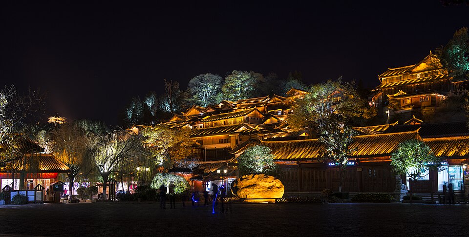 Lijiang old town rooftops glowing at night