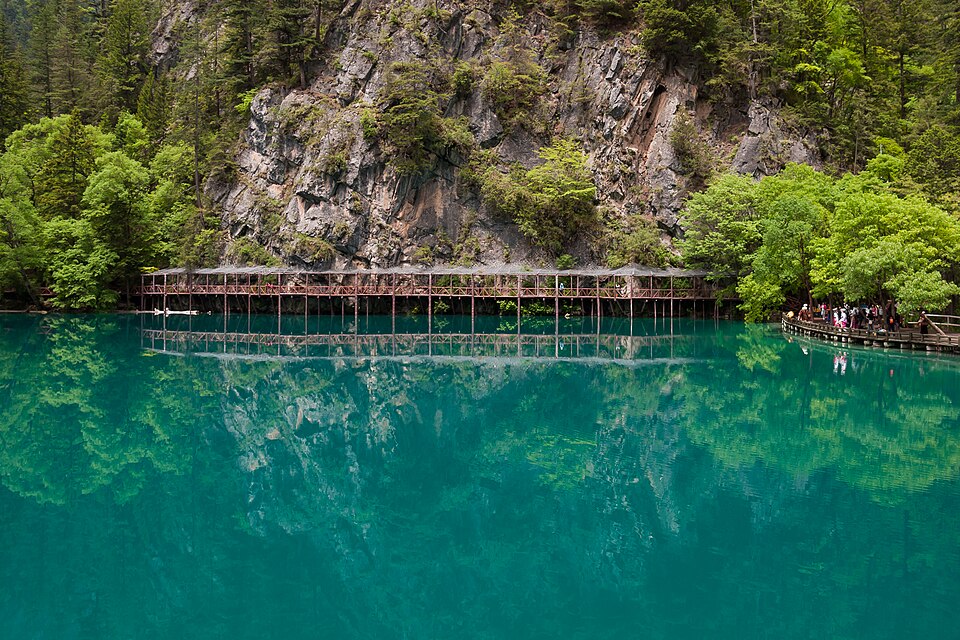 A turquoise lake among forested slopes in Jiuzhaigou, Sichuan