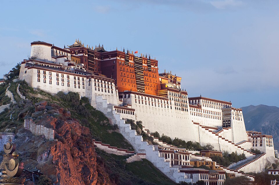 The white and red walls of the Potala Palace on its hill above Lhasa