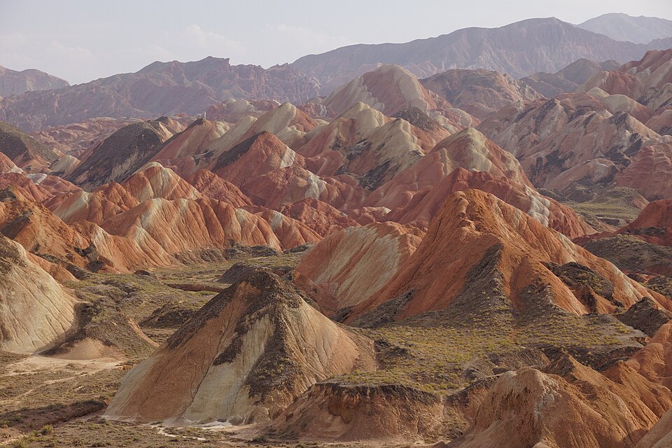 Striped red and ochre rock ridges of the Zhangye Danxia landform in Gansu